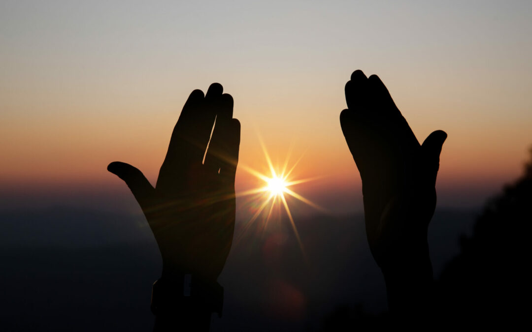 Faith of christian concept: Spiritual prayer hands over sun shin